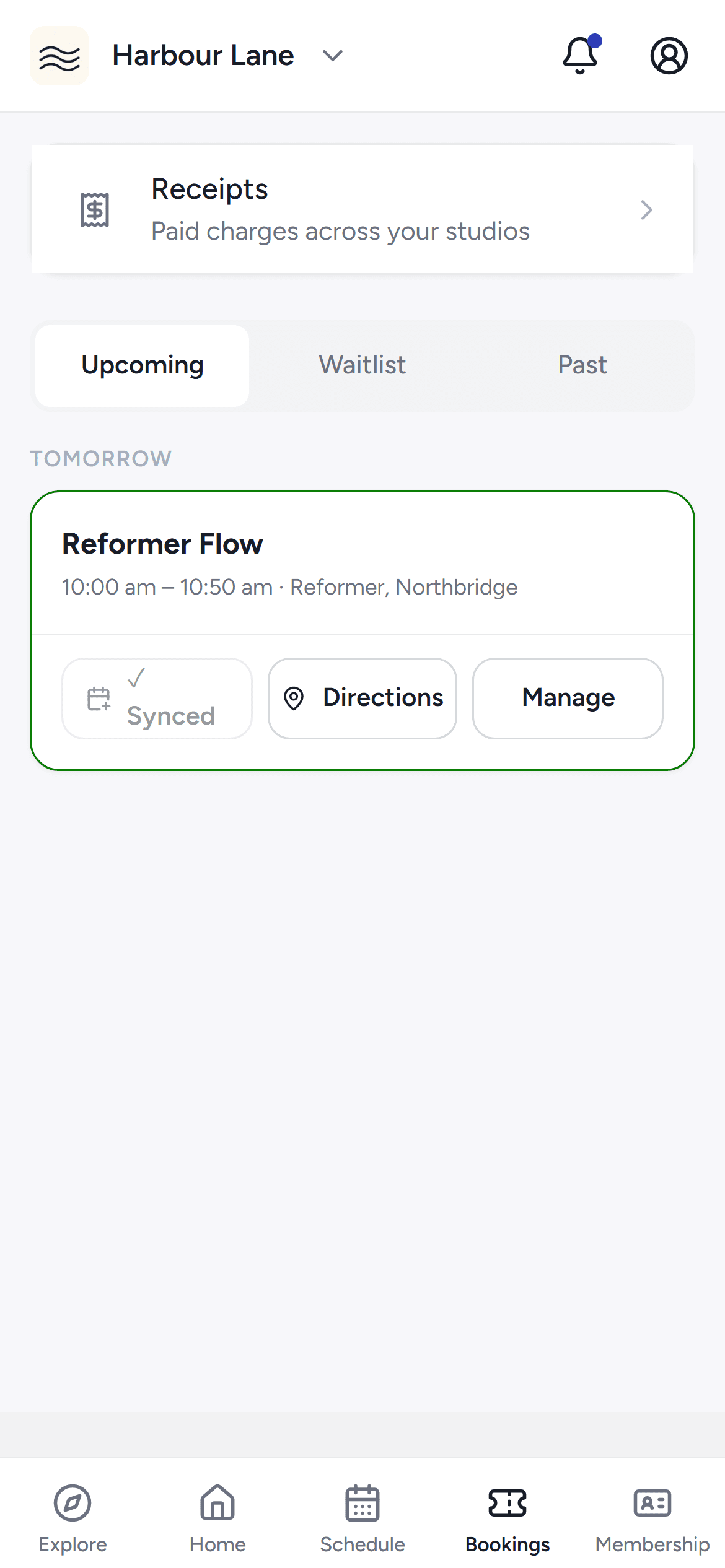 The Bookings tab of the phone app with upcoming and past classes.