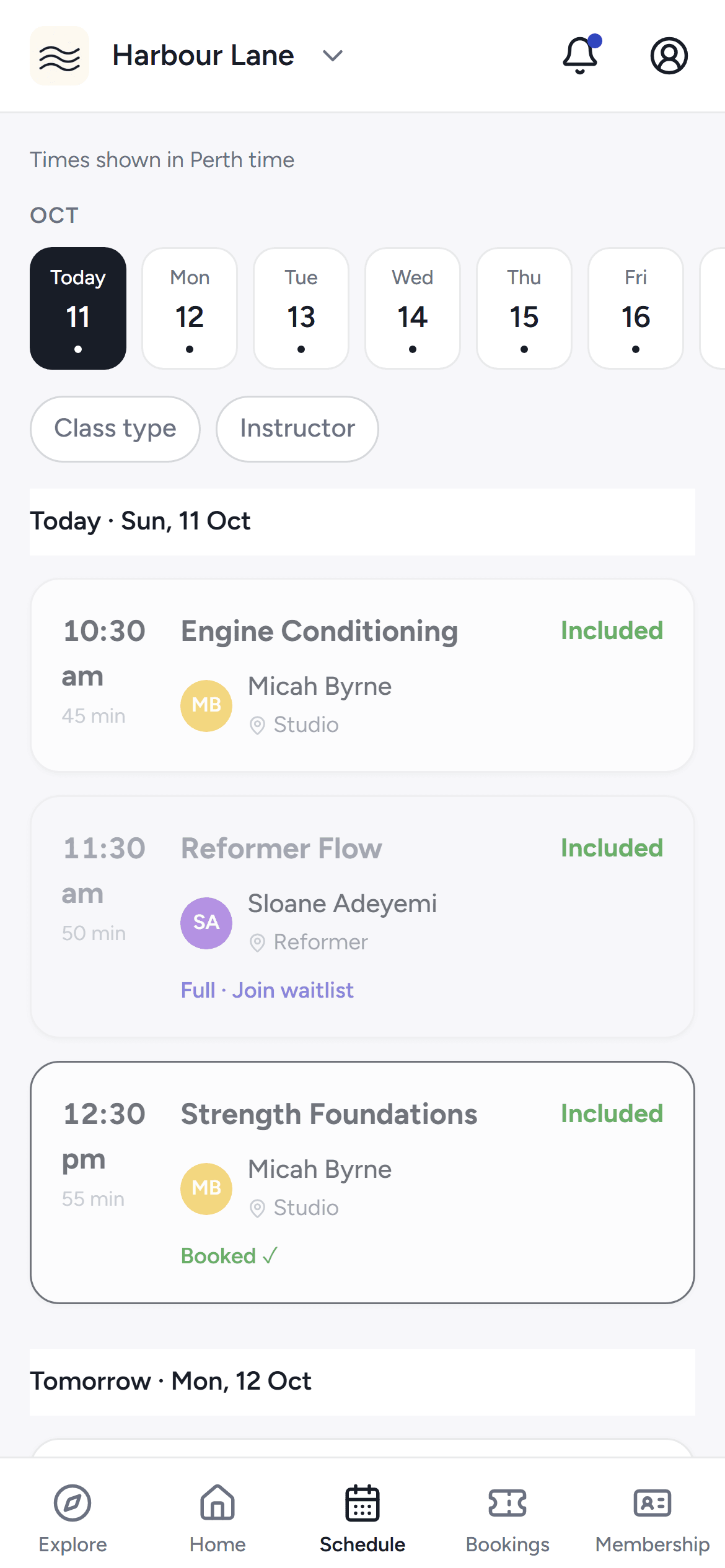 The studio's class schedule in the phone app with day chips and bookable classes.